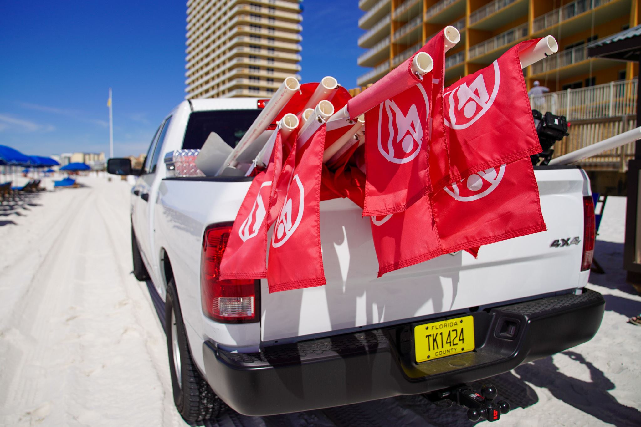 Truck with double red beach flags
